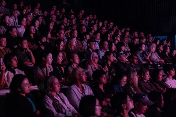 Audience members.